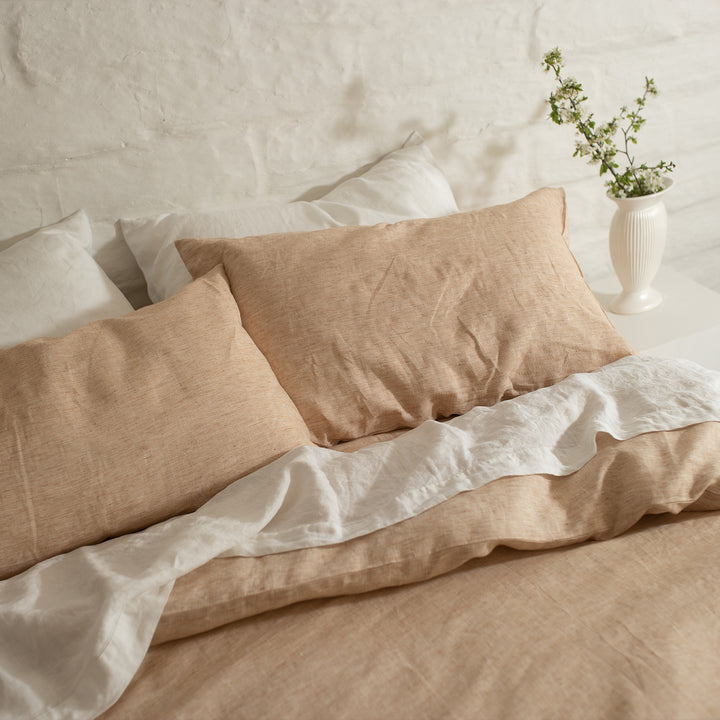 A cropped photo of a bed dressed in Cinnamon and White bed linen. Sizes: Queen, King, Super King