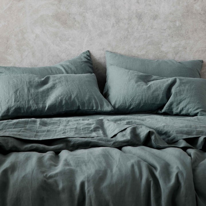 A cropped photo of a bed dressed in Bluestone bed linen. Sizes: Double, Queen, King, Super King