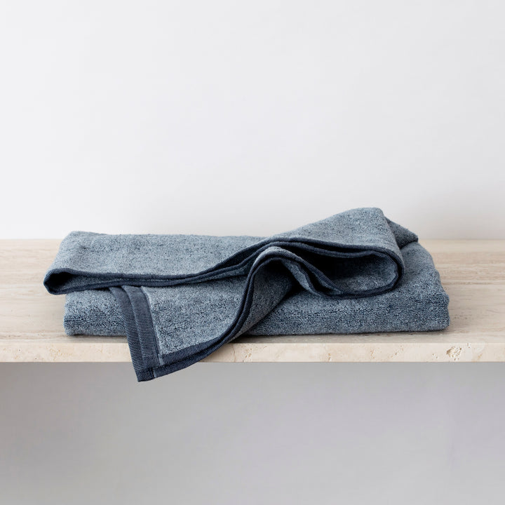 Folded bath denim bath towel. izes: Bath Towel - 70cm x 140cm, Bath Sheet - 90cm x 175cm