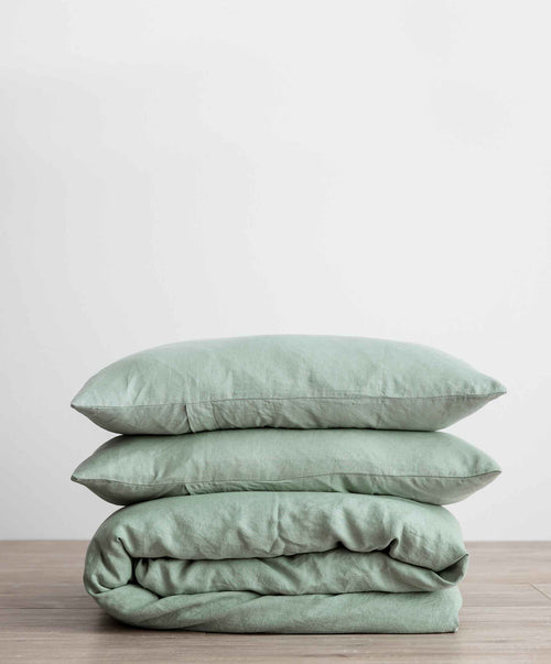 Linen Duvet Cover Set in soft sage with two matching pillowcases, showcasing natural texture and relaxed style.