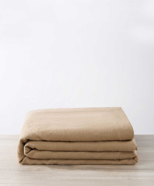 Bedroom Edit - Sand, Blush & Natural folded premium linen bedcover showcasing natural texture and sustainable quality The beauty of home