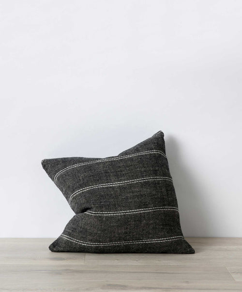 Mira Linen Cushion Cover - Rafa in dark natural linen with subtle white stripes on light wood surface The beauty of home