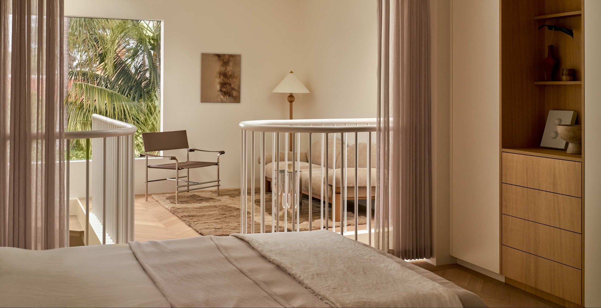Modern bedroom with a view of a balcony and outdoor area.