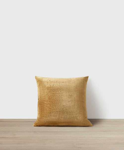 Talik Velvet Square Cushion Cover - Bronze in rich velvet fabric resting on natural wood surface The beauty of home