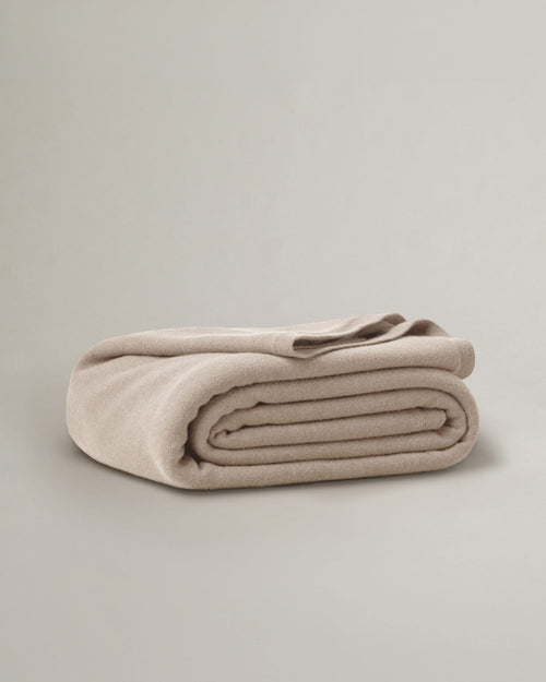100% NZ Merino Wool Blanket - Oatmeal folded on a neutral background