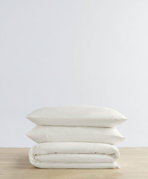 Linen Duvet Cover Set - Ivory neatly folded with soft, breathable natural texture for premium bedding The beauty of home