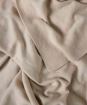 Close-up of beige fabric with a soft texture