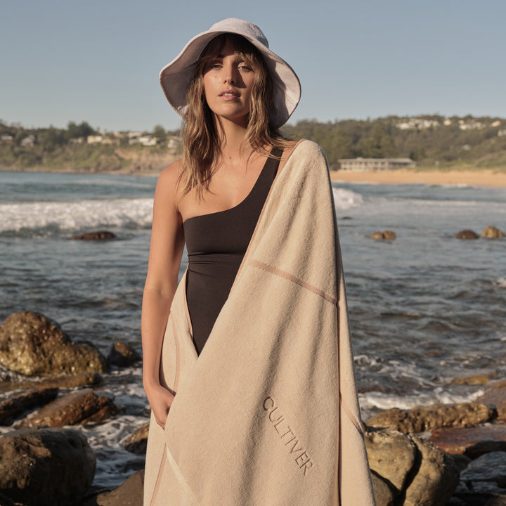 A woman with Beach Towel in Rose