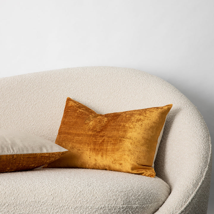 Talik Velvet Cushions in Mustard, on a boucle lounge. Size: 50 x 50cm, 60 x 40cm