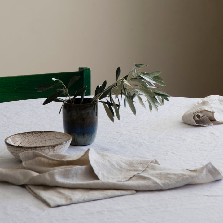 A table setting featuring Linen Table Napkins in Natural